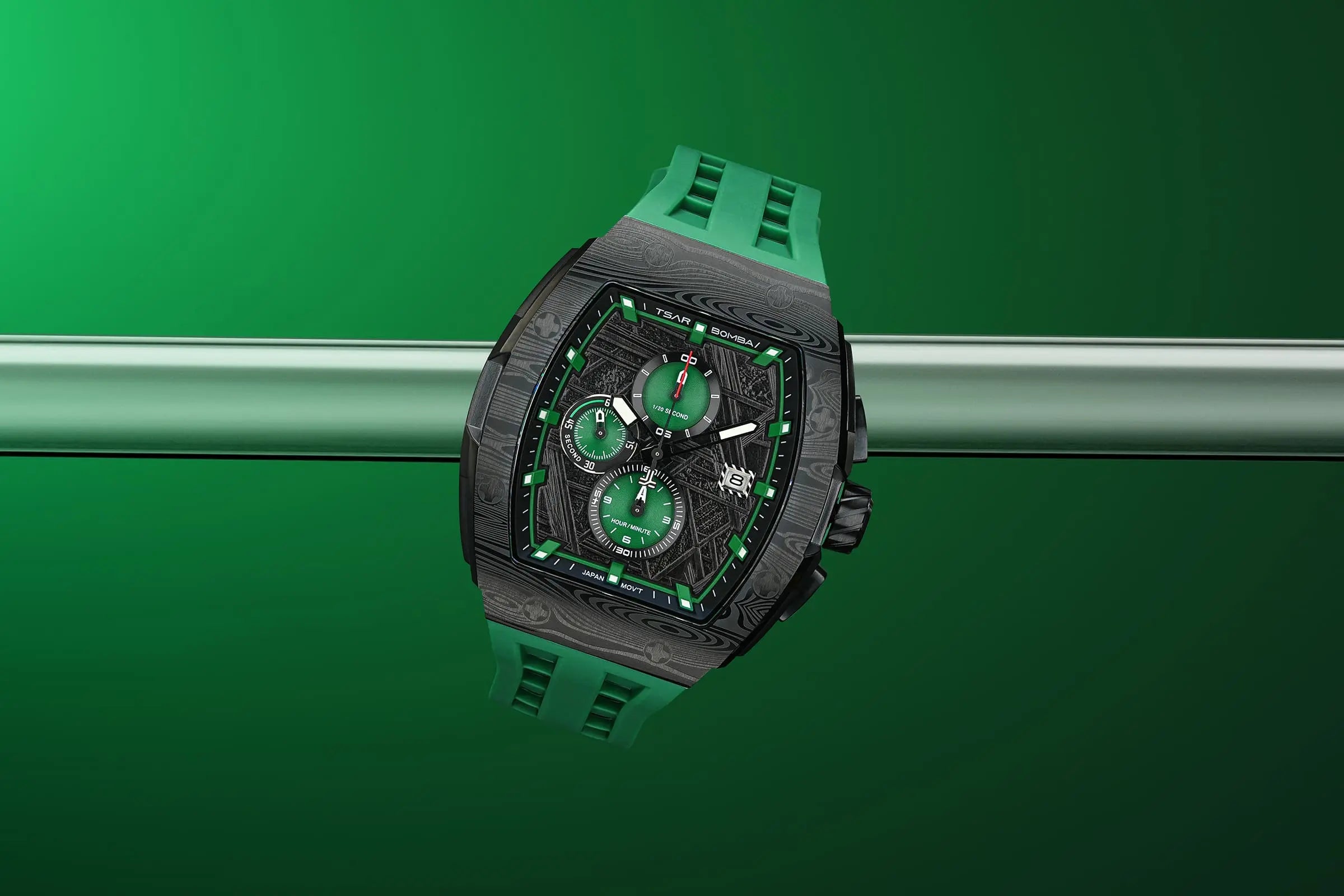  TSAR BOMBA Elemental TB8211Q Stainless Steel Tonneau Chronograph Watch. Features a stainless steel case and a precision-machined quartz movement. The textured dial integrates date display and chronograph function. A 1/20th-second counter is located at 12 o'clock, the date display at 3 o'clock, the hour/minute counter at 6 o'clock, and the seconds counter at 9 o'clock.--Scene display