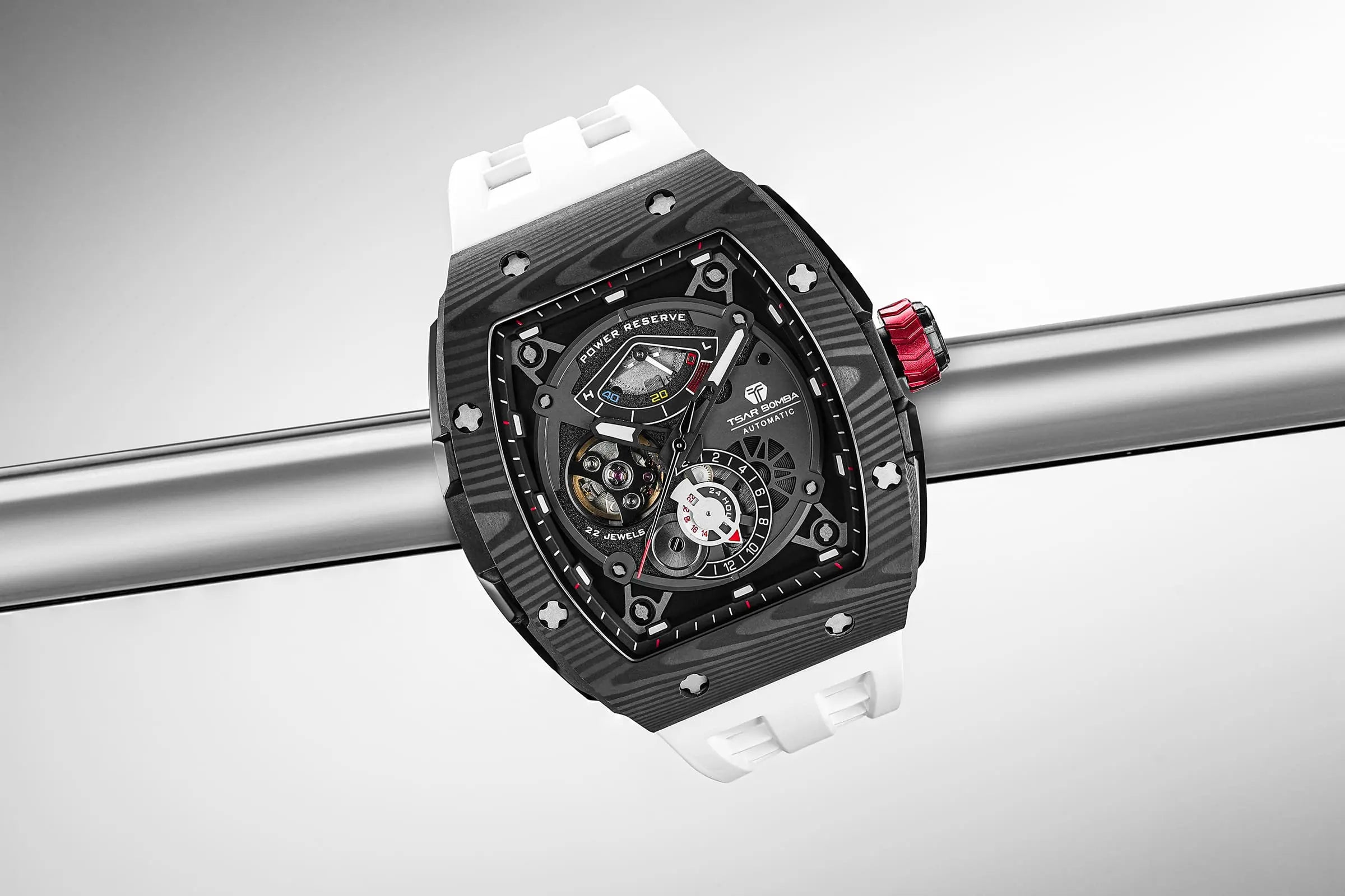 The TSAR BOMBA Elemental TB8211Q Stainless Steel Tonneau Chronograph Watch. Features a stainless steel case and a Seiko quartz movement. The multi-layered skeleton dial combines date display and chronograph functions. A 1/20th-second chronograph subdial is located at 12 o'clock, the date display at 3 o'clock, the hour/minute chronograph subdial at 6 o'clock, and the chronograph seconds subdial at 9 o'clock.-- Scene display