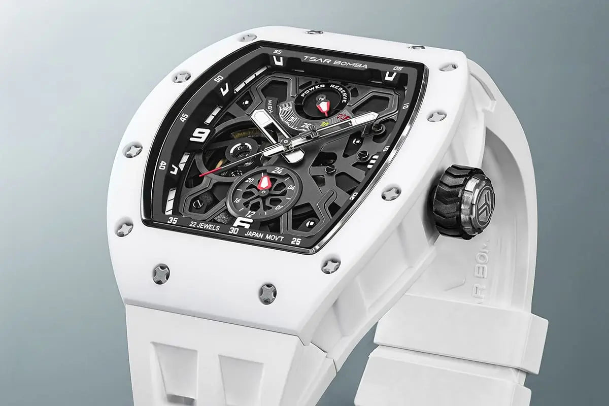 TSAR BOMBA Elemental TB8212 Skeletonized Automatic Mechanical Watch. Powered by a Seiko Epson automatic movement, featuring a lightweight and skin-friendly all-ceramic case. Equipped with Grade A luminous coating, scratch-resistant sapphire crystal, and a fluoroelastomer strap. Water resistant to 50 meters (5 ATM). White case and strap top view.
