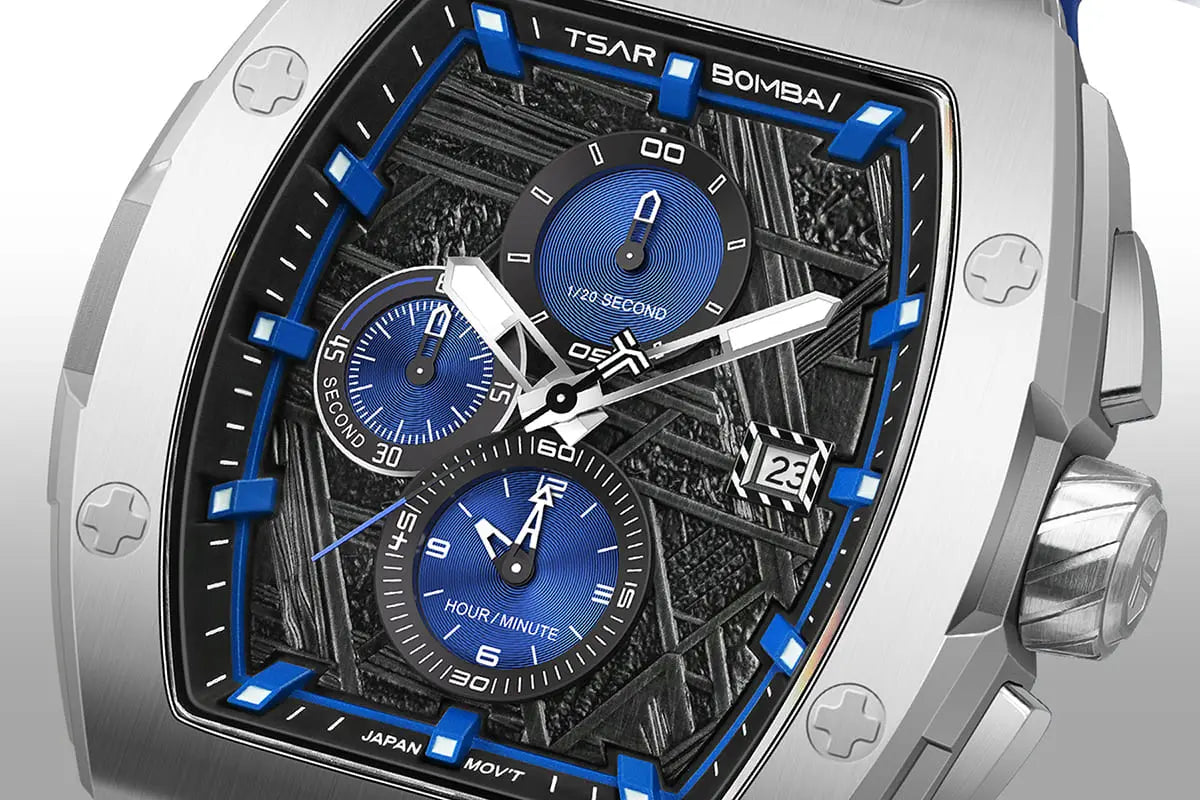  TSAR BOMBA Elemental TB8211Q Stainless Steel Tonneau Chronograph Watch. Features a stainless steel case and a precision-machined quartz movement. The textured dial integrates date display and chronograph function. A 1/20th-second counter is located at 12 o'clock, the date display at 3 o'clock, the hour/minute counter at 6 o'clock, and the seconds counter at 9 o'clock.--dial-display