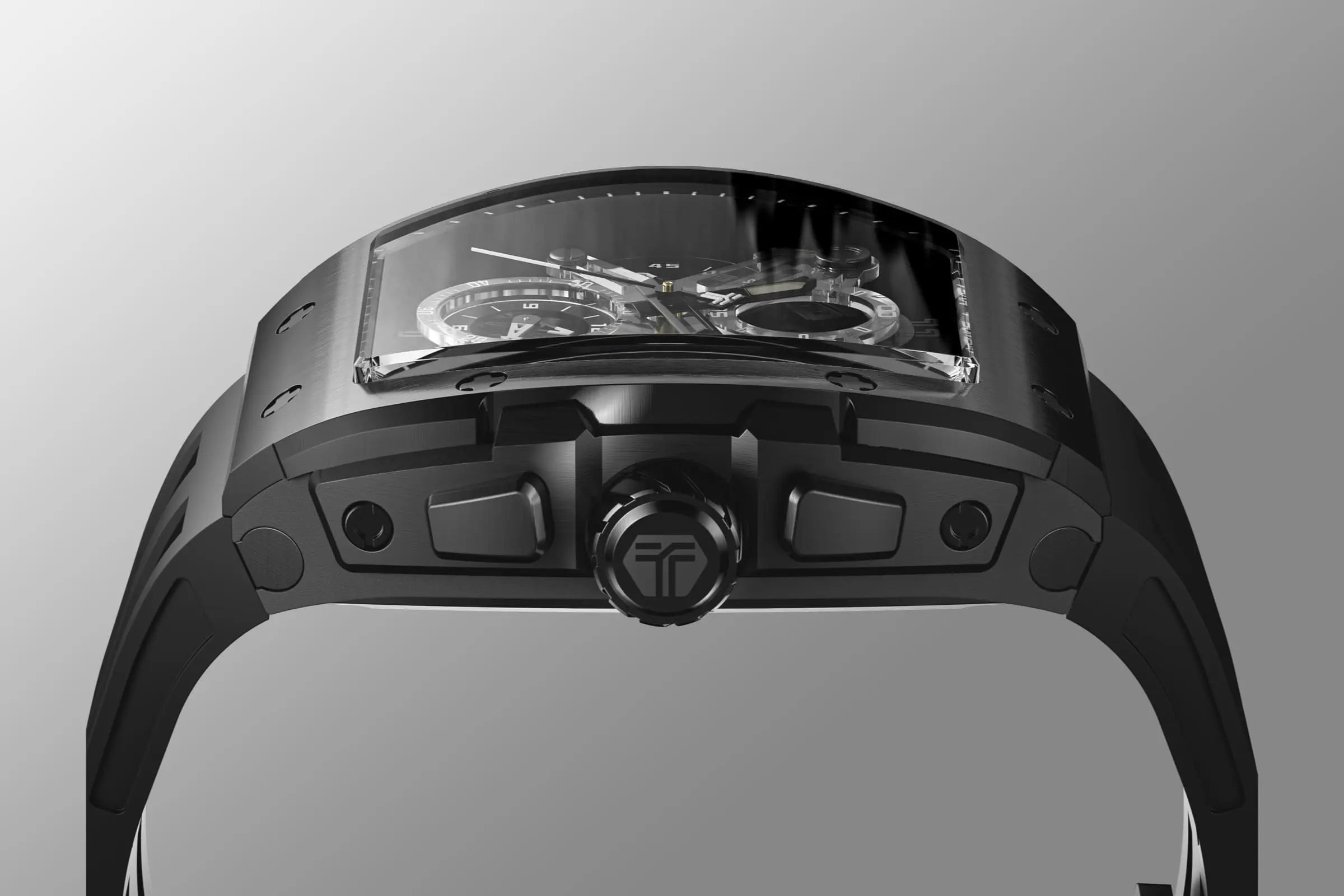 The TSAR BOMBA Elemental TB8211Q Stainless Steel Tonneau Chronograph Watch. Features a stainless steel case and a Seiko quartz movement. The multi-layered skeleton dial combines date display and chronograph functions. A 1/20th-second chronograph subdial is located at 12 o'clock, the date display at 3 o'clock, the hour/minute chronograph subdial at 6 o'clock, and the chronograph seconds subdial at 9 o'clock.--Side view