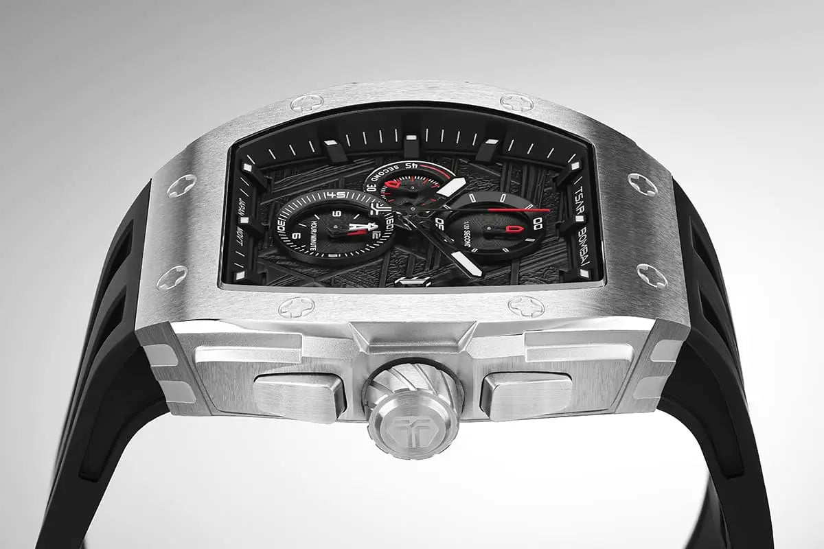  TSAR BOMBA Elemental TB8211Q Stainless Steel Tonneau Chronograph Watch. Features a stainless steel case and a precision-machined quartz movement. The textured dial integrates date display and chronograph function. A 1/20th-second counter is located at 12 o'clock, the date display at 3 o'clock, the hour/minute counter at 6 o'clock, and the seconds counter at 9 o'clock.--dial-Side view