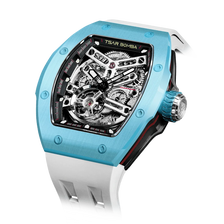 TSAR BOMBA Atomic TB8218C automatic skeleton tonneau men watch; ceramic bezel and stainless steel case and fluororubber strap; Features a ceramic bezel and an interchangeable fluoro-rubber strap. Utilizes TSAR BOMBA’s patented technology for interchangeable straps, bezels, and crowns. Quickly swap modules without tools—since your watch can change its style, why buy another one? Left three-quarter angle view-- Light Blue