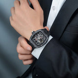 TSAR BOMBA Elemental TB8212 Skeleton Automatic Mechanical Watch. Powered by a Seiko Epson automatic movement, the full ceramic case is lightweight, skin-friendly.  It features Grade A luminescent coating, a scratch-resistant sapphire crystal, and a fluororubber strap. Water-resistant to 50 meters (5 ATM).--Model wearing display