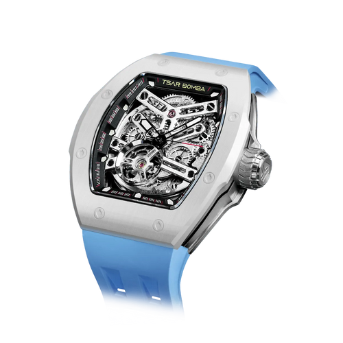 TSAR BOMBA Atomic TB8218C automatic skeleton tonneau men watch; ceramic bezel and stainless steel case and fluororubber strap; Features a ceramic bezel and an interchangeable fluoro-rubber strap. Utilizes TSAR BOMBA’s patented technology for interchangeable straps, bezels, and crowns. Quickly swap modules without tools—since your watch can change its style, why buy another one? Left three-quarter angle view-- White Blue