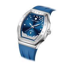 The TSAR BOMBA Lumina is a diamond-set luxury automatic ladies' watch. The dial and bezel are set with 79 lab-grown diamonds totaling 0.66 carats. The watch is powered by a Japanese automatic movement. It features TSAR BOMBA's patented interchangeable strap function, an A-grade luminous coating, a scratch-resistant sapphire crystal, and a comfortable, interchangeable fluoroelastomer strap. It is water-resistant to 50 meters (5 ATM).-blue-Left three-quarter view