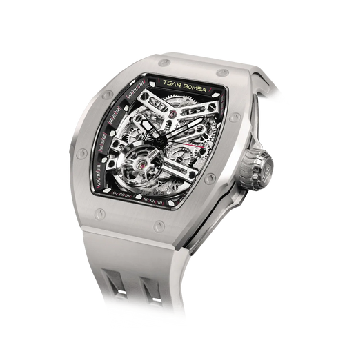TSAR BOMBA Atomic TB8218C automatic skeleton tonneau men watch; ceramic bezel and stainless steel case and fluororubber strap; Features a ceramic bezel and an interchangeable fluoro-rubber strap. Utilizes TSAR BOMBA’s patented technology for interchangeable straps, bezels, and crowns. Quickly swap modules without tools—since your watch can change its style, why buy another one? Left three-quarter angle view-- Ghost Grey
