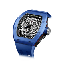 TSAR BOMBA Atomic TB8218C automatic skeleton tonneau men watch; ceramic bezel and stainless steel case and fluororubber strap; Features a ceramic bezel and an interchangeable fluoro-rubber strap. Utilizes TSAR BOMBA’s patented technology for interchangeable straps, bezels, and crowns. Quickly swap modules without tools—since your watch can change its style, why buy another one? Left three-quarter angle view-- blue

