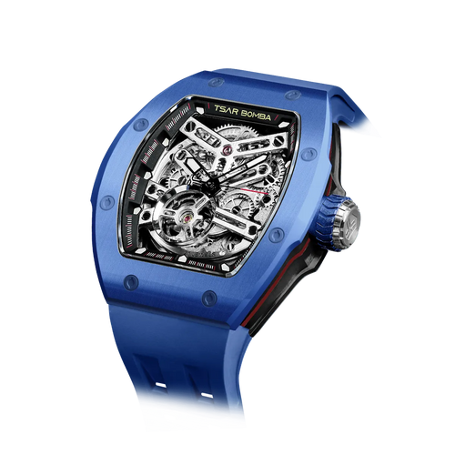 TSAR BOMBA Atomic TB8218C automatic skeleton tonneau men watch; ceramic bezel and stainless steel case and fluororubber strap; Features a ceramic bezel and an interchangeable fluoro-rubber strap. Utilizes TSAR BOMBA’s patented technology for interchangeable straps, bezels, and crowns. Quickly swap modules without tools—since your watch can change its style, why buy another one? Left three-quarter angle view-- blue
