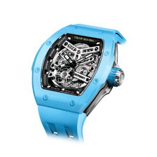 TSAR BOMBA Atomic TB8218C automatic skeleton tonneau men watch; ceramic bezel and stainless steel case and fluororubber strap; Features a ceramic bezel and an interchangeable fluoro-rubber strap. Utilizes TSAR BOMBA’s patented technology for interchangeable straps, bezels, and crowns. Quickly swap modules without tools—since your watch can change its style, why buy another one? Left three-quarter angle view-- sky blue