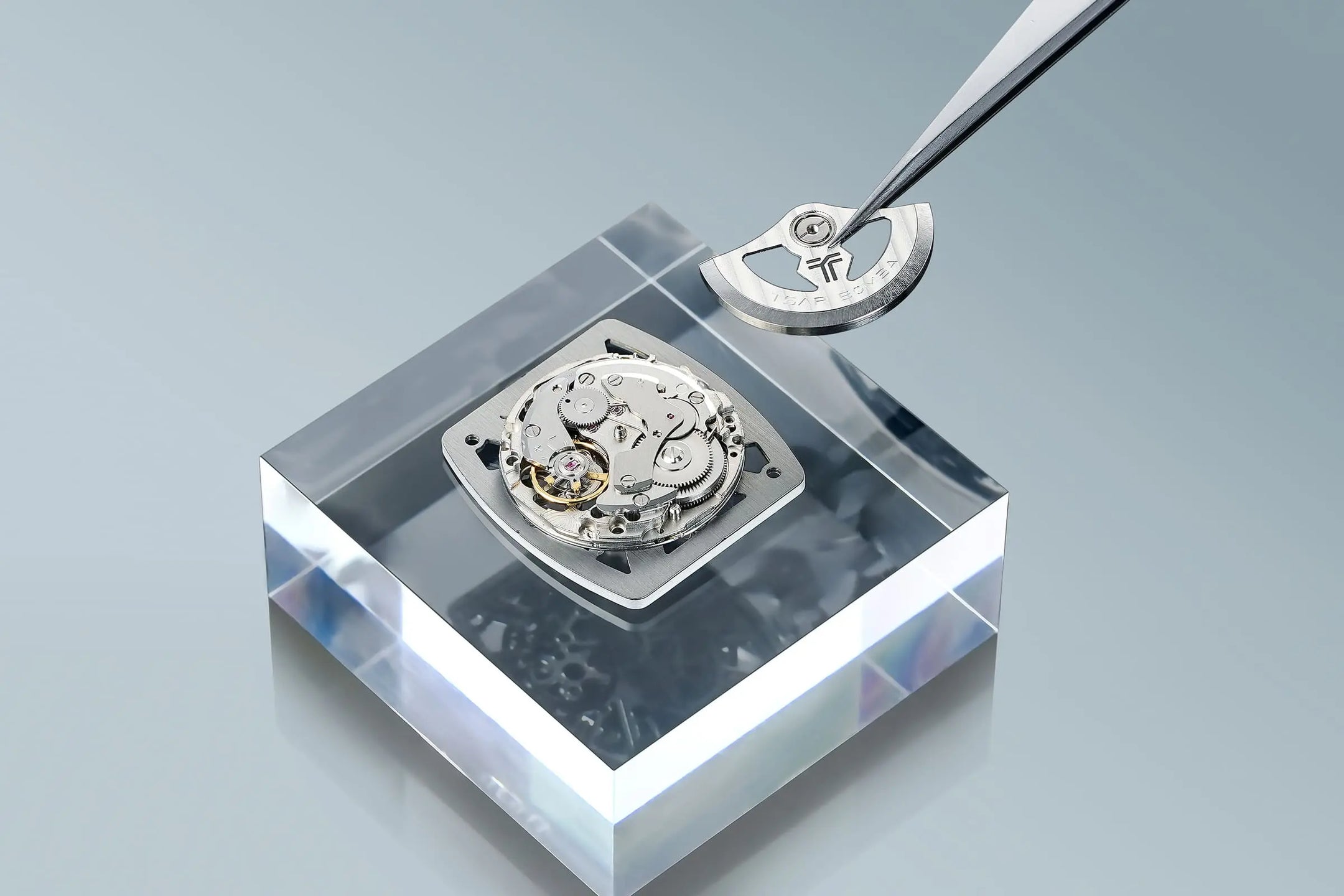 TSAR BOMBA Light Matter TB8223 Transparent Men's Watch. This watch features a TSAR BOMBA Chronite® case, allowing for quick and easy strap changes without tools. It is powered by a Japanese automatic movement with a flying tourbillon at 9 o'clock. The TB8223 includes a Grade A luminous coating, a scratch-resistant sapphire crystal, and a replaceable fluoroelastomer strap. It is water-resistant to 30 meters (3 ATM). white strap--Scene display--dial-dispaly