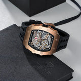 TSAR BOMBA TB8208A rose gold-tone tonneau skeleton watch with a black strap, displayed on a textured black presentation box.