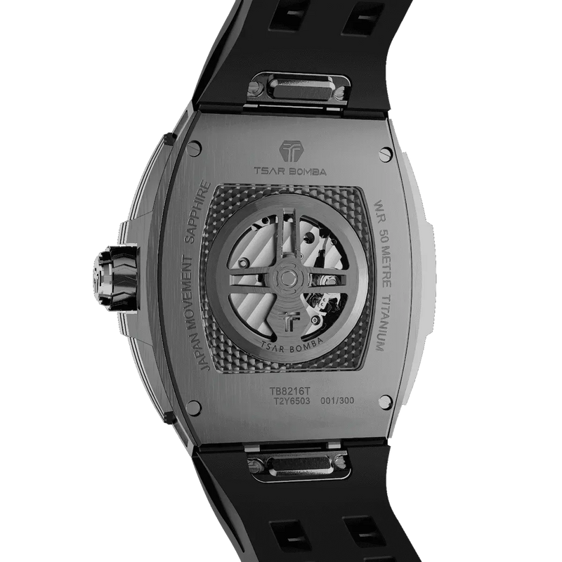TSAR BOMBA TB8216 limited-edition tonneau watch, viewed from the rear, featuring a carbon fiber bezel and titanium case and black interchangeable strap. The power reserve indicator is at 12 o’clock, and the tourbillon is at 9 o’clock.--