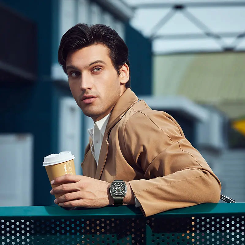 TSAR BOMBA TB8216 limited-edition tonneau watch, Model wearing and display, featuring a carbon fiber bezel and titanium case and black interchangeable strap. The power reserve indicator is at 12 o’clock, and the tourbillon is at 9 o’clock.--