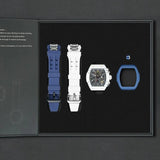 The image shows the TSAR BOMBA Atomic TB8214 interchangeable set. The set includes a  blue and white fluororubber strap, a carbon fiber white bezel and  blue fluororubber bezel, and a white and  blue crown. TSAR BOMBA's patented interchangeable module allows for quick and easy replacement of watch modules without tools, enabling interchangeable straps, crowns, and bezels. Instead of buying multiple watches, why not own one watch that can be styled in various ways?