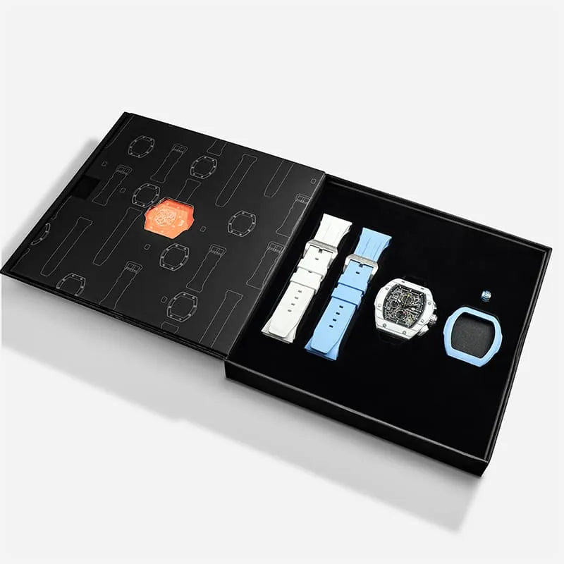 The image shows the TSAR BOMBA Atomic TB8214 interchangeable set. The set includes a sky blue and white fluororubber strap, a sky blue and white fluororubber bezel, and a white and black crown. TSAR BOMBA's patented interchangeable module allows for quick and easy replacement of watch modules without tools, enabling interchangeable straps, crowns, and bezels. Instead of buying multiple watches, why not own one watch that can be styled in various ways?--Set display and packaging box