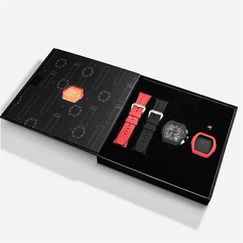 The image shows the TSAR BOMBA Atomic TB8214 interchangeable set. The set includes a black and red fluororubber strap, a black and red fluororubber bezel, and a red and black crown. TSAR BOMBA's patented interchangeable module allows for quick and easy replacement of watch modules without tools, enabling interchangeable straps, crowns, and bezels. Instead of buying multiple watches, why not own one watch that can be styled in various ways?--Set display and packaging box