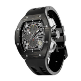 The TSAR BOMBA Atommic TB8214CF carbon fiber tonneau quartz watch. carbon fiber gold bezel and fluororubber interchangeable gold strap.  The Multifunction dial design, the multifunction dial features a chronograph minute sub-dial at the 12 o'clock position, a date display between the 4 and 5 o'clock positions, a seconds sub-dial at the 6 o'clock position, and an hour chronograph sub-dial at the 9 o'clock position. --Left three-quarter-view