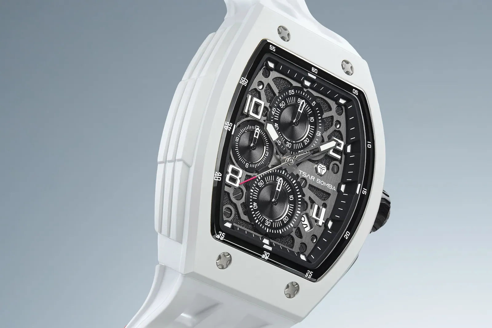 The TSAR BOMBA Elemental TB8224B BIO-ceramic tonneau quartz watch.White bezel and white strap.  The Multifunction dial design, the multifunction dial features a chronograph minute sub-dial at the 12 o'clock position, a date display between the 4 and 5 o'clock positions, a seconds sub-dial at the 6 o'clock position, and an hour chronograph sub-dial at the 9 o'clock position. --Right-three-quarter-view And reflections.
