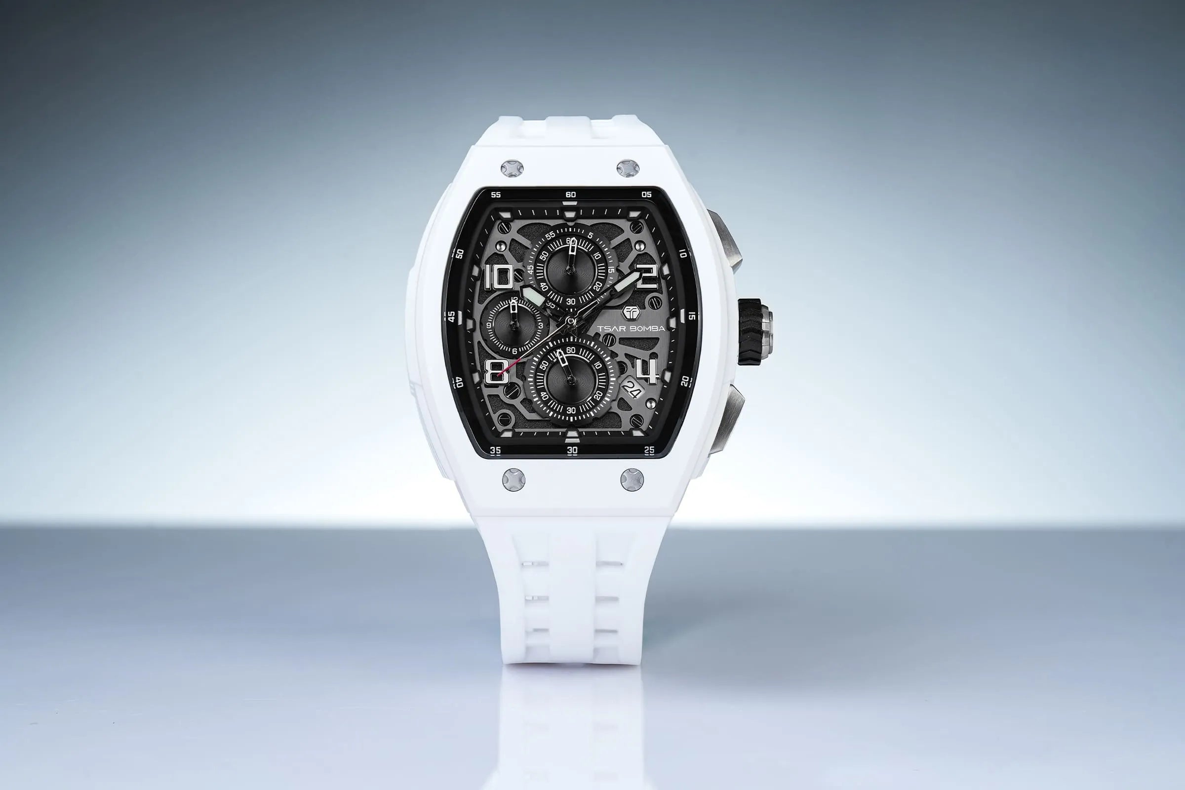 The TSAR BOMBA Elemental TB8224B BIO-ceramic tonneau quartz watch.White bezel and white strap.  The Multifunction dial design, the multifunction dial features a chronograph minute sub-dial at the 12 o'clock position, a date display between the 4 and 5 o'clock positions, a seconds sub-dial at the 6 o'clock position, and an hour chronograph sub-dial at the 9 o'clock position. --Front view And reflections.