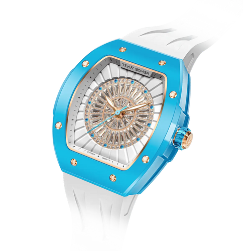 TSAR BOMBA Nucleus femme 03 Ceramic Ladies' Watch. Features a ceramic case and a ceramic dial set with a zirconia diamond. Powered by a Swiss Ronda quartz movement. Extremely lightweight (approximately 60 grams). Equipped with Grade A luminous coating, scratch-resistant sapphire crystal, and a replaceable fluoroelastomer strap. Water resistant to 50 meters (5 ATM). blue bezel and white strap.--
Left three-quarter-angled-view
