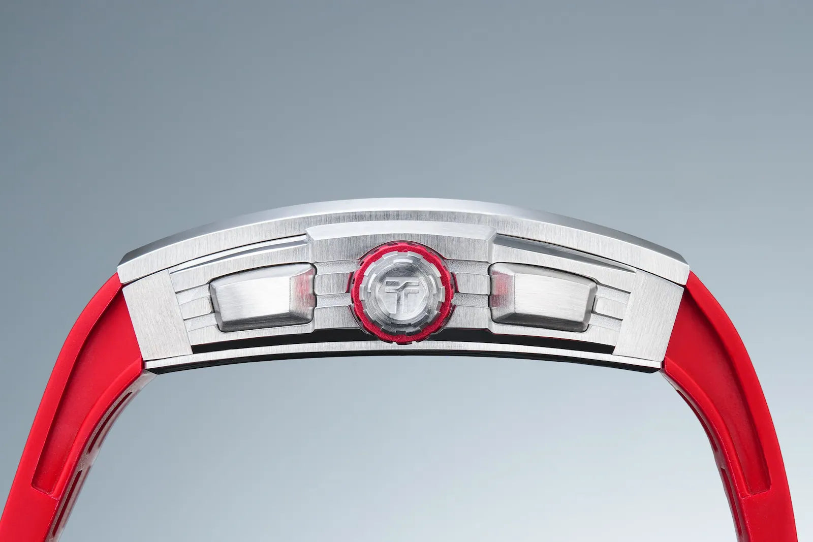 A side view of the TSAR-BOMBA TB8204Q. This barrel-shaped case features a slightly arched profile that conforms to the curve of the wrist, offering greater comfort than a flat case back.