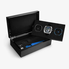 Powered by a Seiko Epson movement, A power reserve indicator is positioned at 12 o'clock; the stable movement delivers a power reserve of 50 hours (±10%). A 24-hour display dial is located at 6 o'clock, while a visible tourbillon is featured at 9 o'clock. The Dark Matter 2 features Grade A luminescent coating, scratch-resistant sapphire crystal, and a interchangeable fluororubber strap. Water-resistant to 100 meters (10 ATM).-set box display